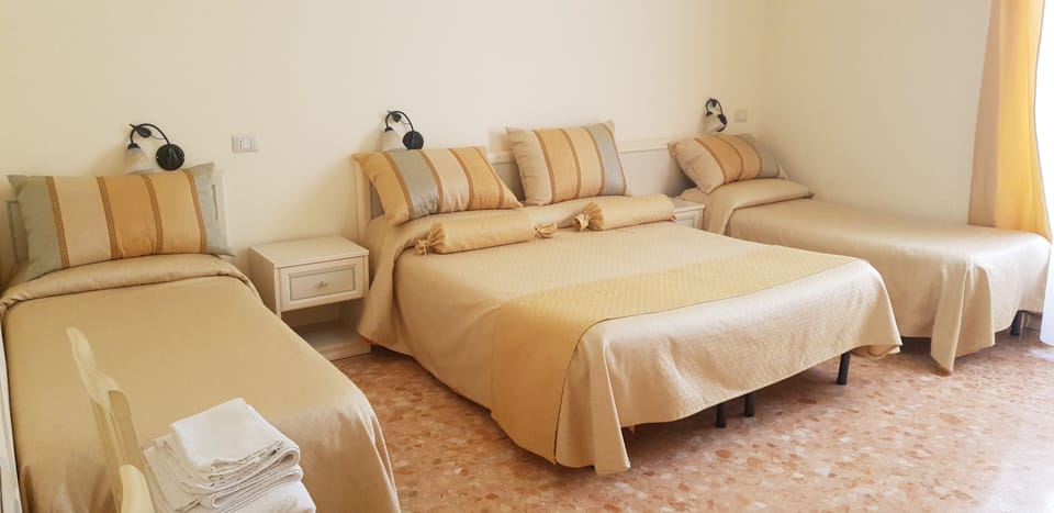 Classic Quadruple Room | Minibar, in-room safe, desk, iron/ironing board