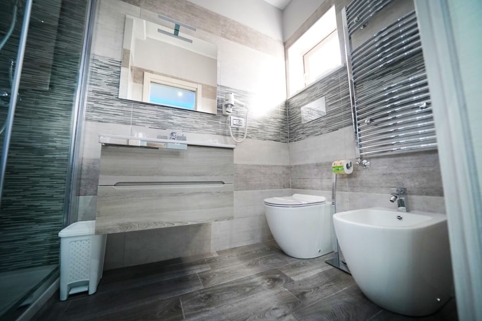 Exclusive Suite, 1 Queen Bed, Balcony, City View | Bathroom | Shower, free toiletries, hair dryer, bathrobes