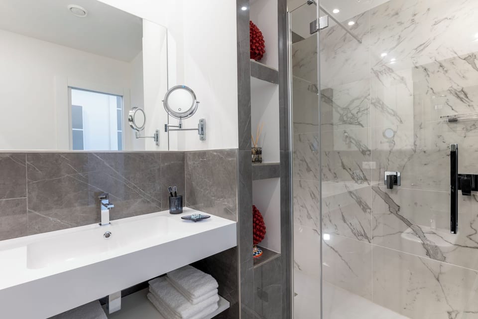 Superior Room | Bathroom | Jetted tub, rainfall showerhead, designer toiletries, hair dryer
