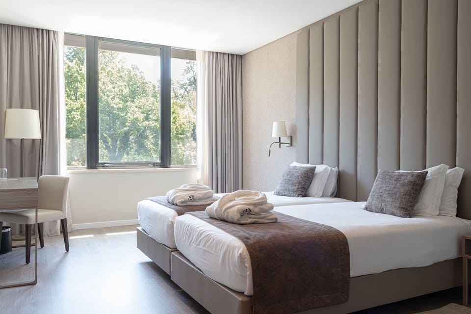 Deluxe Double or Twin Room (Collection) | Minibar, in-room safe, desk, blackout drapes