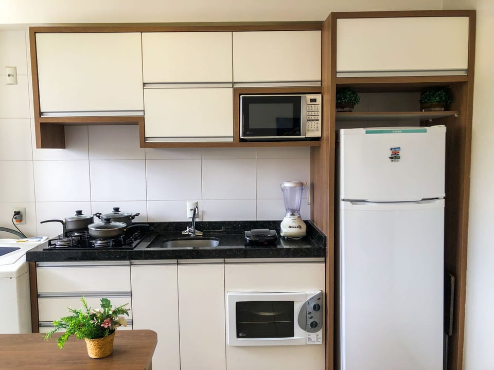 Family Apartment, 2 Bedrooms, Pool View, Beachside | Private kitchen | Full-size fridge, microwave, oven, stovetop