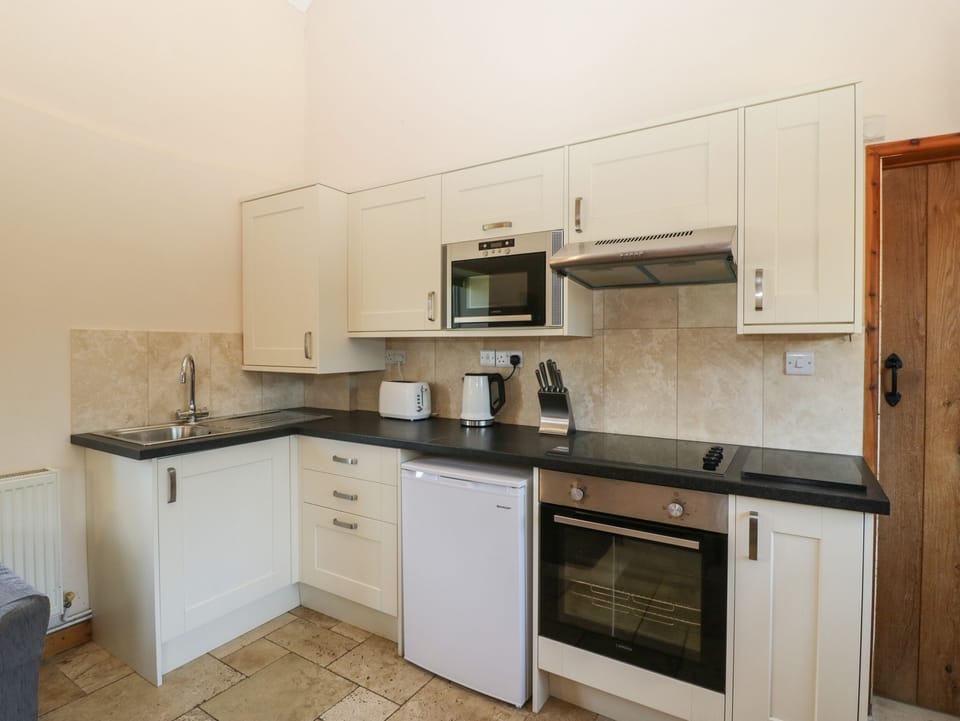 Fridge, electric kettle, toaster, cookware/dishes/utensils