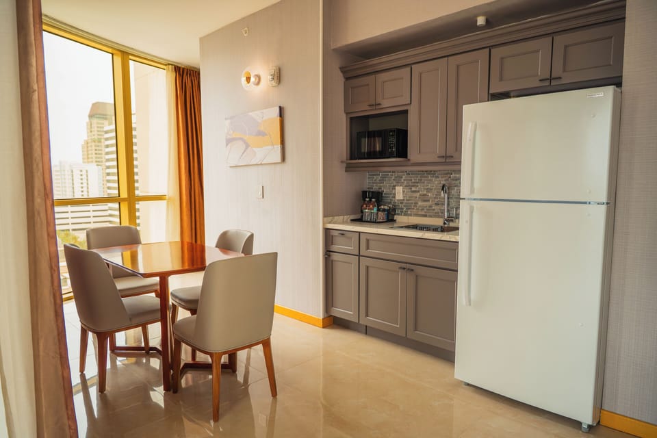 Deluxe Suite | Living area | 50-inch Smart TV with cable channels, TV
