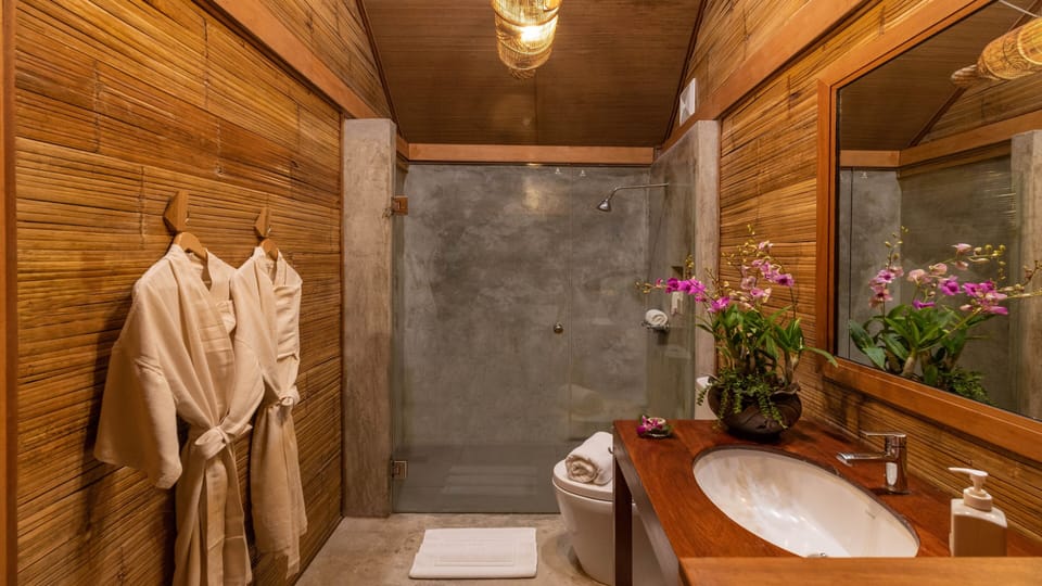 Grand Village | Bathroom | Shower, free toiletries, hair dryer, slippers