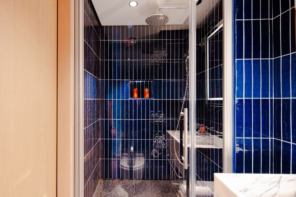Shower, free toiletries, hair dryer, slippers