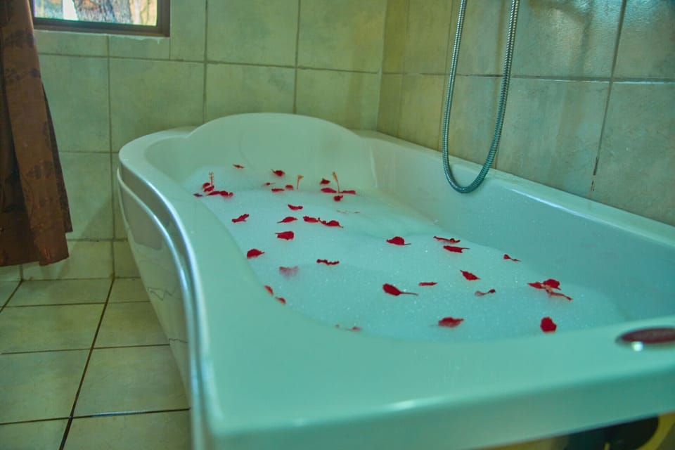 Separate tub and shower, rainfall showerhead, free toiletries, bathrobes