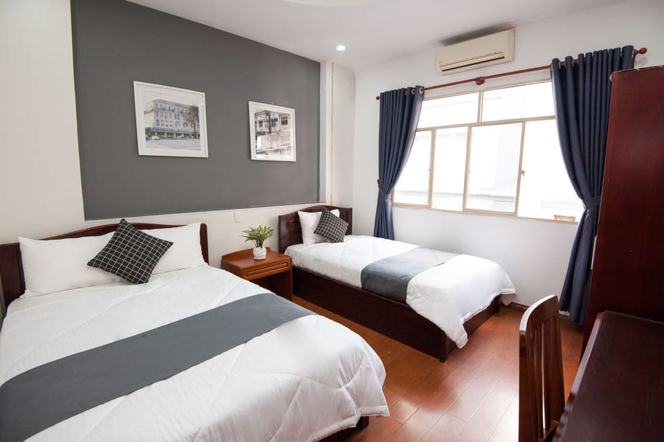 Basic Triple Room, Multiple Beds | In-room safe, free WiFi, bed sheets