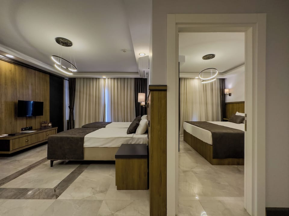 Family Suite | Free minibar items, in-room safe, desk, laptop workspace