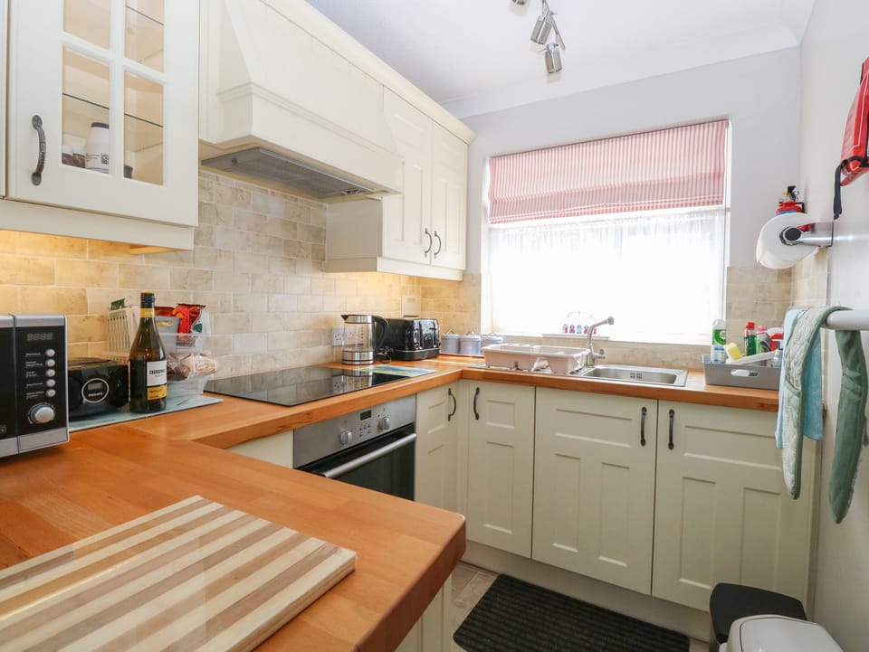 Fridge, electric kettle, toaster, cookware/dishes/utensils