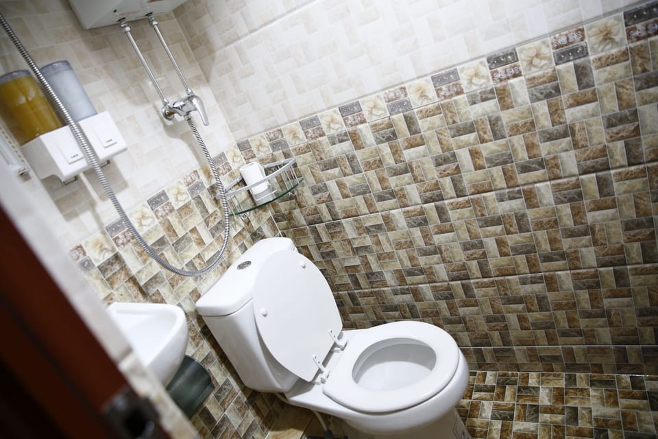 Shower, free toiletries, hair dryer, slippers