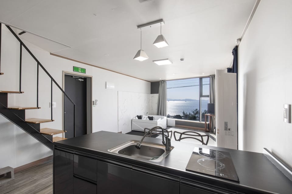 Deluxe Room - Room 101, Room 102 randomly assigned (spa bath available once a day) | Private kitchen | Fridge, microwave, rice cooker, cookware/dishes/utensils