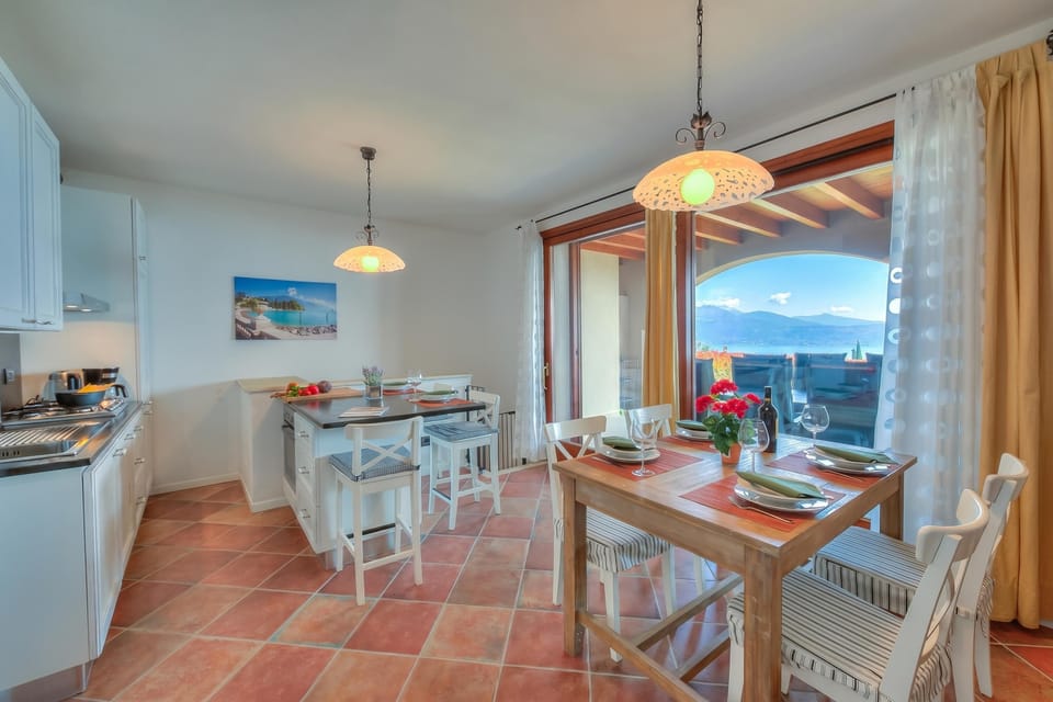 Family Apartment, 2 Bedrooms, 2 Bathrooms, Mountainside (Borgo Belvedere-lake view & shared) | Dining