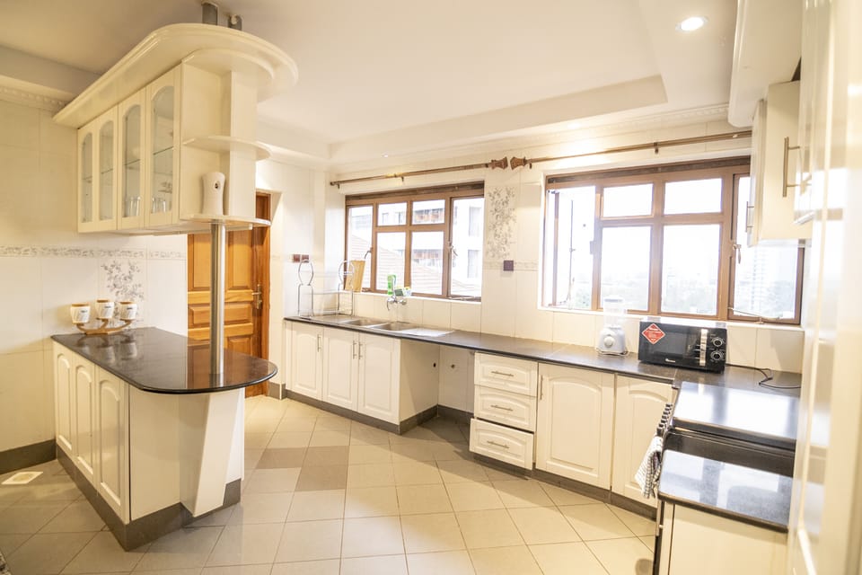 Classic Apartment, 3 Bedrooms, Ensuite | Private kitchen | Coffee/tea maker, electric kettle, toaster, dining tables