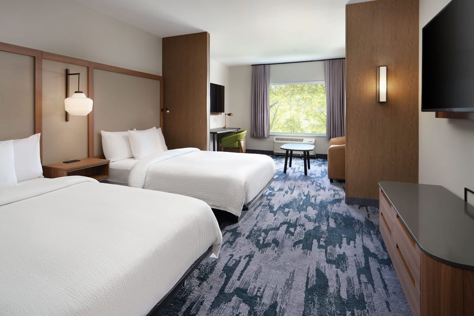 Down comforters, desk, laptop workspace, blackout drapes