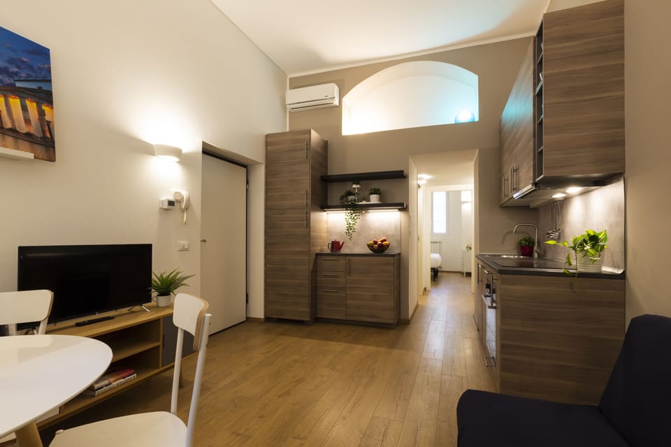 City Apartment | Living area | 32-inch flat-screen TV with digital channels, TV