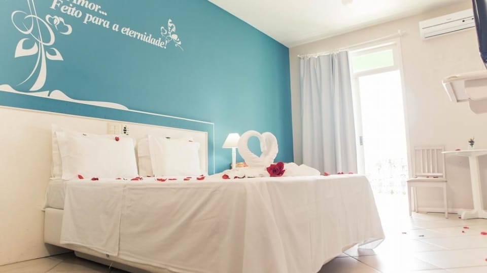 Standard Room, Balcony, Partial Sea View | Minibar, in-room safe, individually decorated, desk