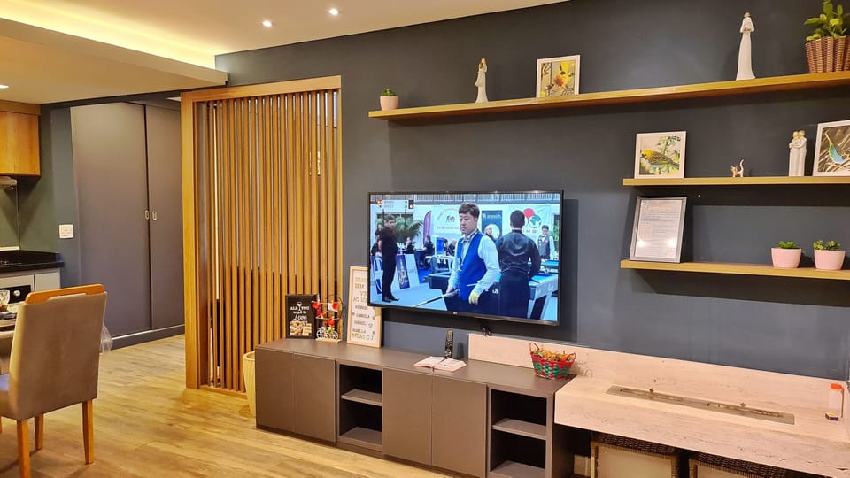 Design Apartment | Living area | 55-inch LED TV with digital channels