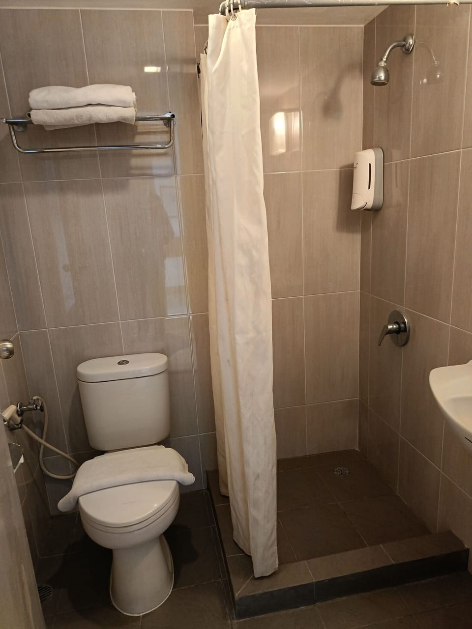 Shower, free toiletries, slippers, soap