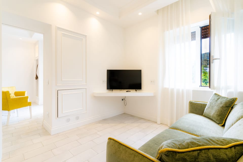 Deluxe Quadruple Room | Premium bedding, minibar, in-room safe, desk
