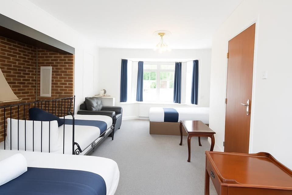 Family Quadruple Room, Multiple Beds, Bathtub, Ground Floor | Iron/ironing board, free WiFi
