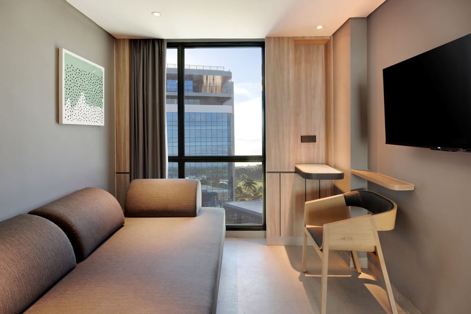 Premium Room, 1 Queen Bed with Sofa bed | Living area | 50-inch Smart TV with cable channels, Netflix, streaming services