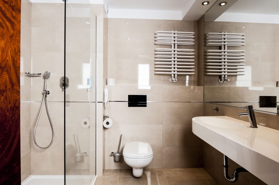 Shower, designer toiletries, hair dryer, bathrobes