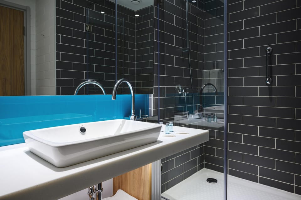 Shower, hair dryer, slippers, towels
