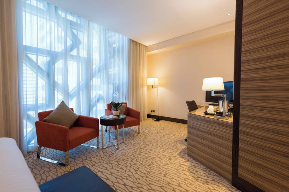Premier Room, 1 King Bed | Living area | 37-inch flat-screen TV with cable channels, TV