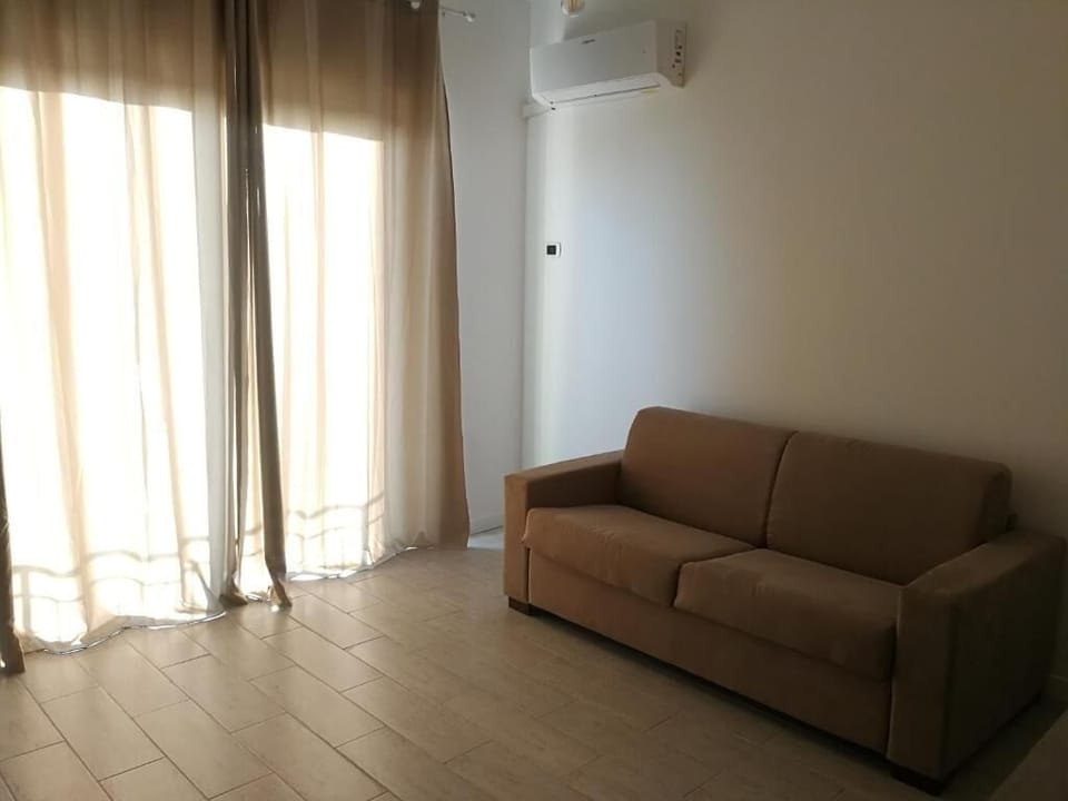 Family Apartment | Living area | 32-inch Smart TV with satellite channels, TV