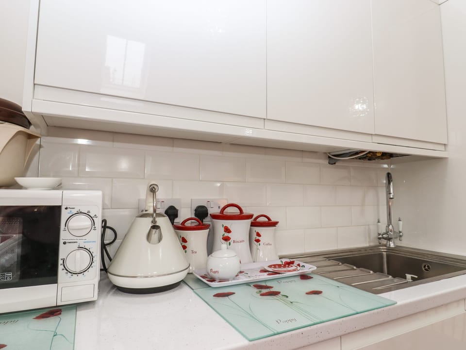 Fridge, electric kettle, toaster, cookware/dishes/utensils