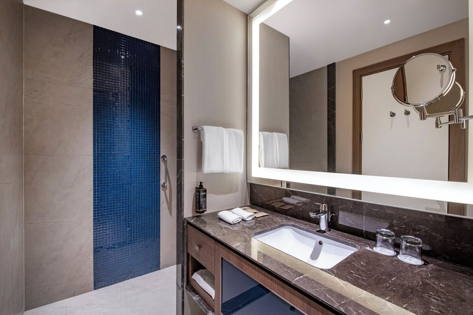Shower, eco-friendly toiletries, hair dryer, slippers