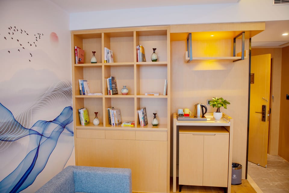 City Studio Suite | Living area | 55-inch TV with cable channels