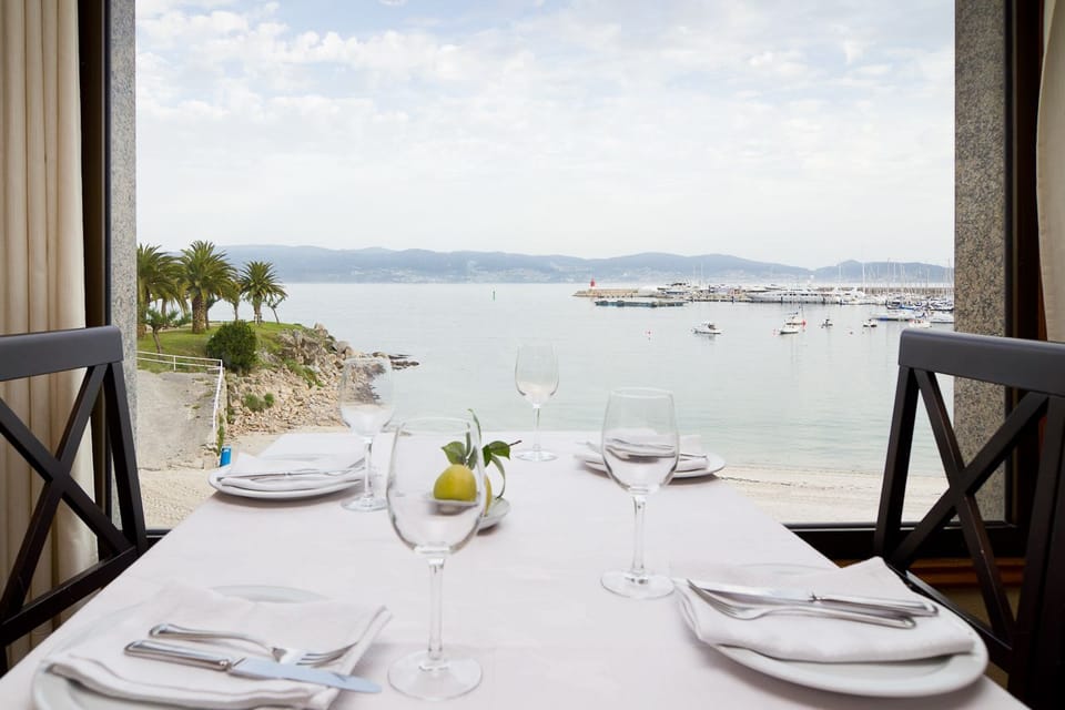 Breakfast, lunch, dinner served; Spanish cuisine, beach views 