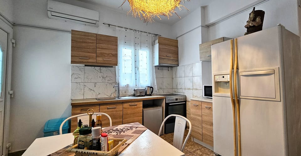 Family Apartment | Private kitchen | Fridge, microwave, coffee/tea maker, dining tables