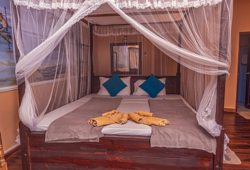 Deluxe Triple Room, Non Smoking, Mountain View | Premium bedding, minibar, individually decorated, individually furnished