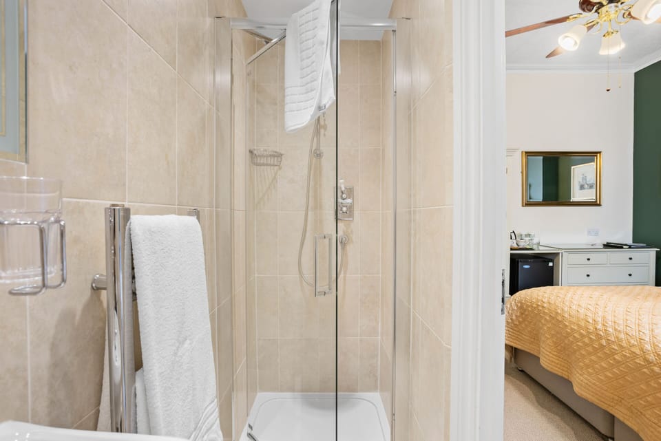 Shower, hair dryer, heated floors, towels