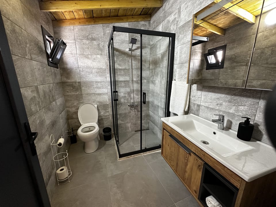 Shower, rainfall showerhead, hair dryer, towels