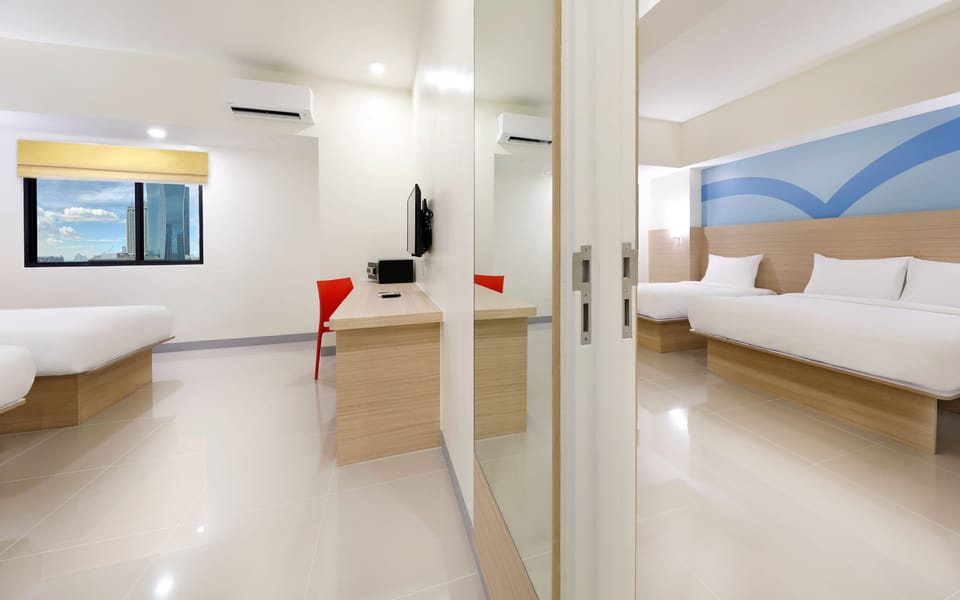 Triple Room | Down comforters, in-room safe, desk, laptop workspace