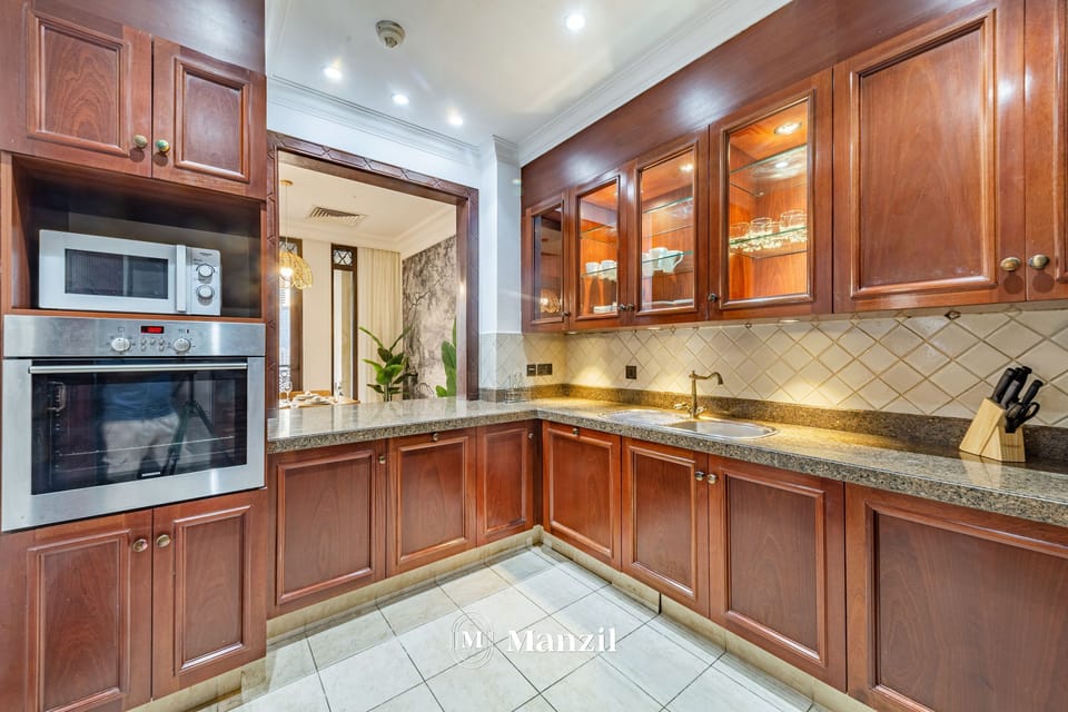 Luxury Apartment | Private kitchen | Fridge, microwave, cleaning supplies, paper towels