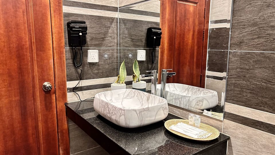 Family Triple Room | Bathroom | Hair dryer, slippers
