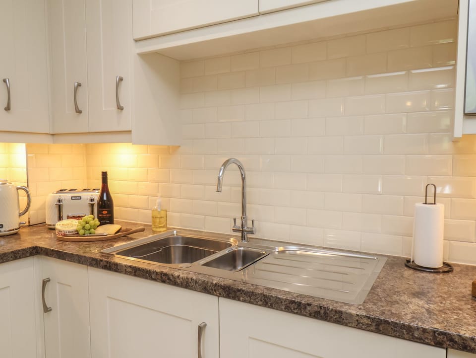 Fridge, electric kettle, cookware/dishes/utensils