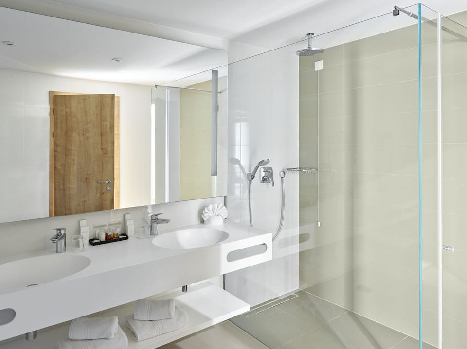 Sea View suite | Bathroom | Designer toiletries, hair dryer, slippers, towels