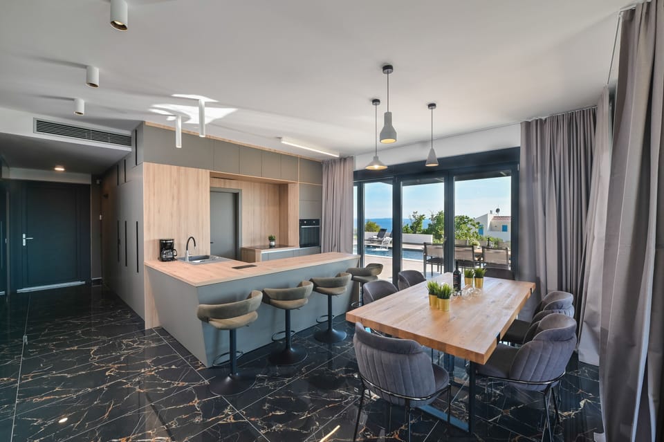 Villa | Private kitchen | Full-size fridge, oven, dishwasher, electric kettle