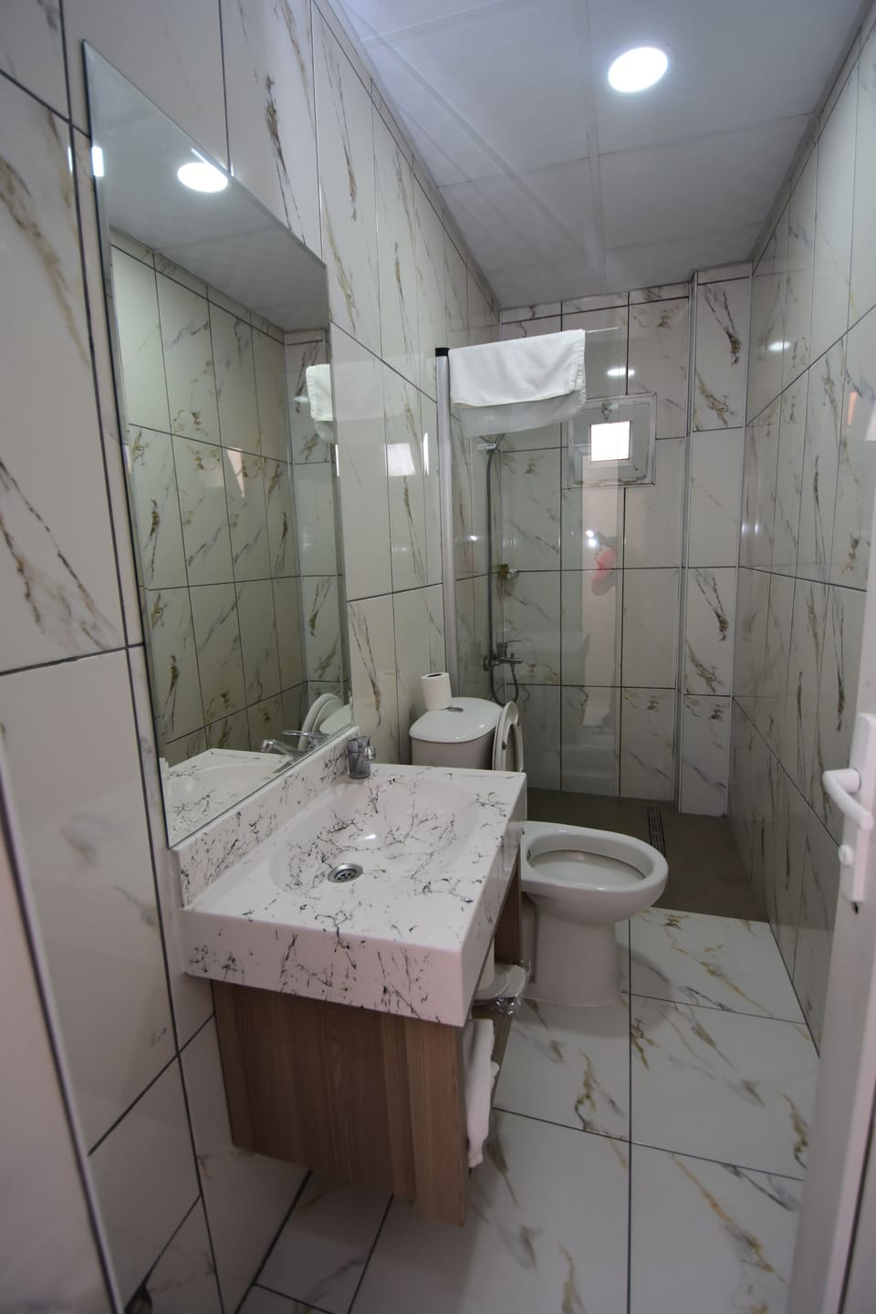 Comfort Room | Bathroom | Shower, rainfall showerhead, hair dryer, towels