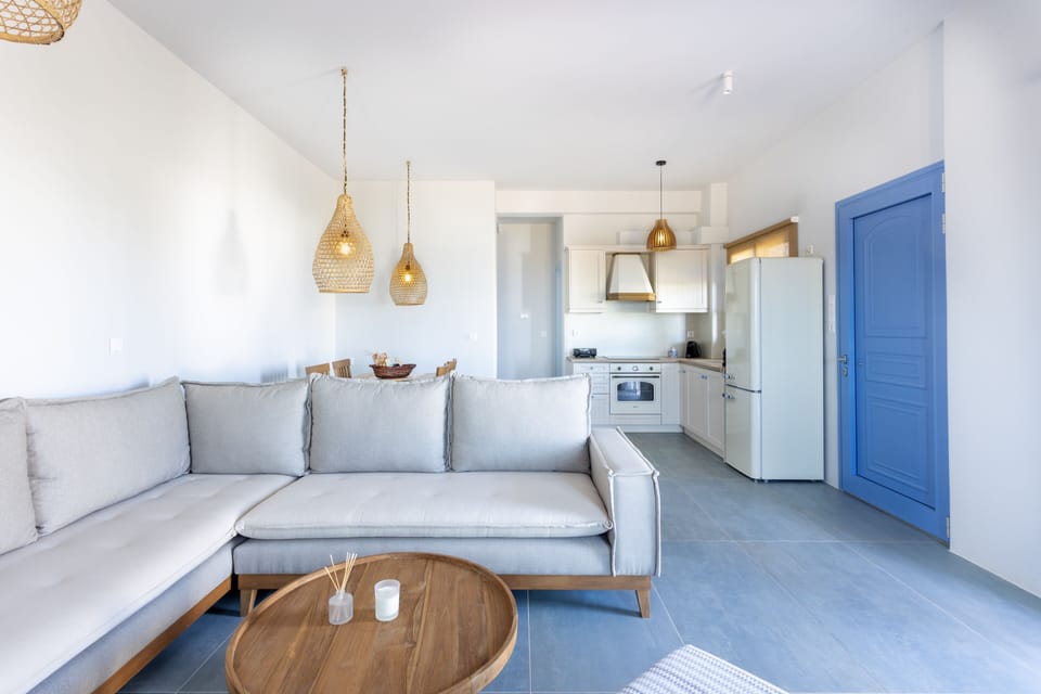 Deluxe Apartment, 1 Bedroom, Sea View | Living area | 50-inch flat-screen TV with digital channels, TV