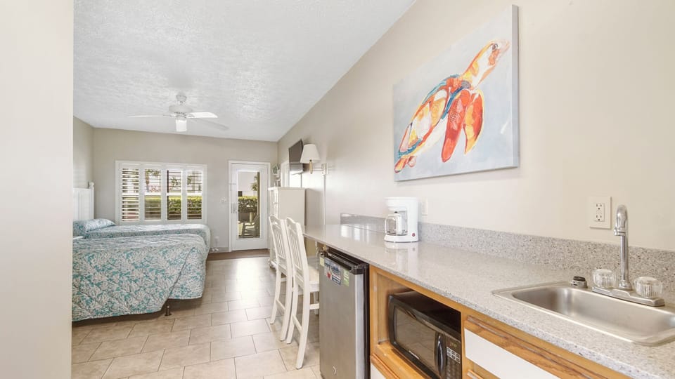 Double Room, Resort View, Beachfront | Desk, laptop workspace, iron/ironing board, cribs/infant beds