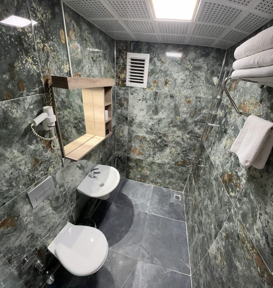 Rainfall showerhead, hair dryer, slippers, towels