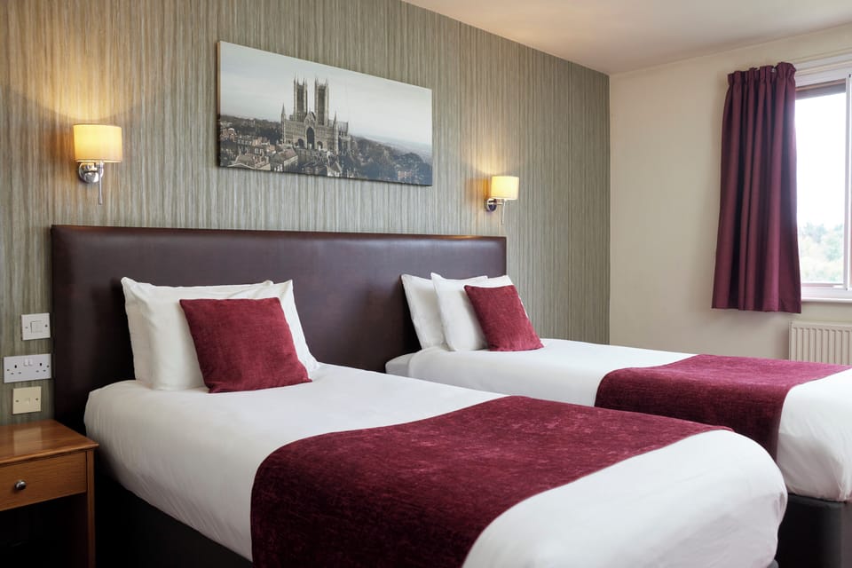 Twin Room | Desk, blackout drapes, iron/ironing board, free cribs/infant beds