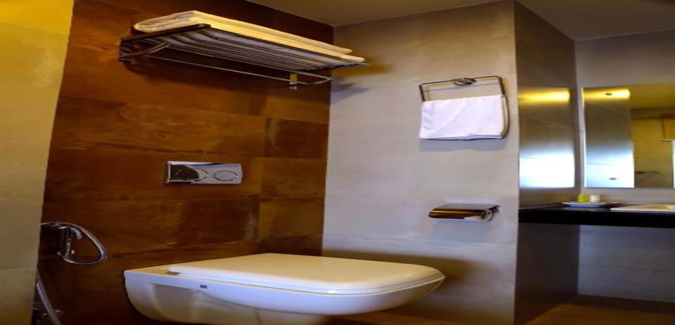 Shower, rainfall showerhead, slippers, towels