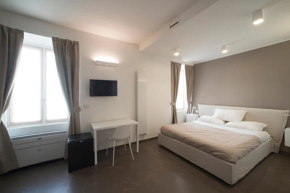Superior Quadruple Room | Down comforters, minibar, individually decorated, individually furnished